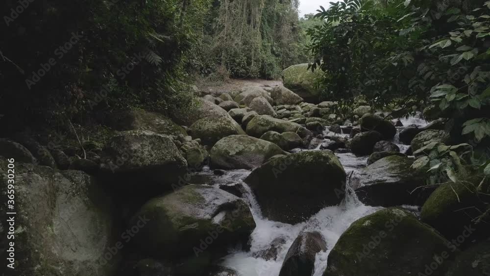 Drone movement inside river, lots of rocks, in rainforest Drone movement inside river, lots of rocks, in rainforest