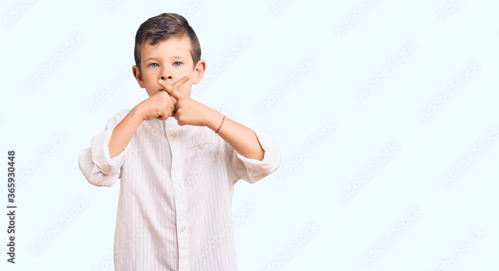 Cute blond kid wearing elegant shirt rejection expression crossing fingers doing negative sign Cute blond kid wearing elegant shirt rejection expression crossing fingers doing negative sign