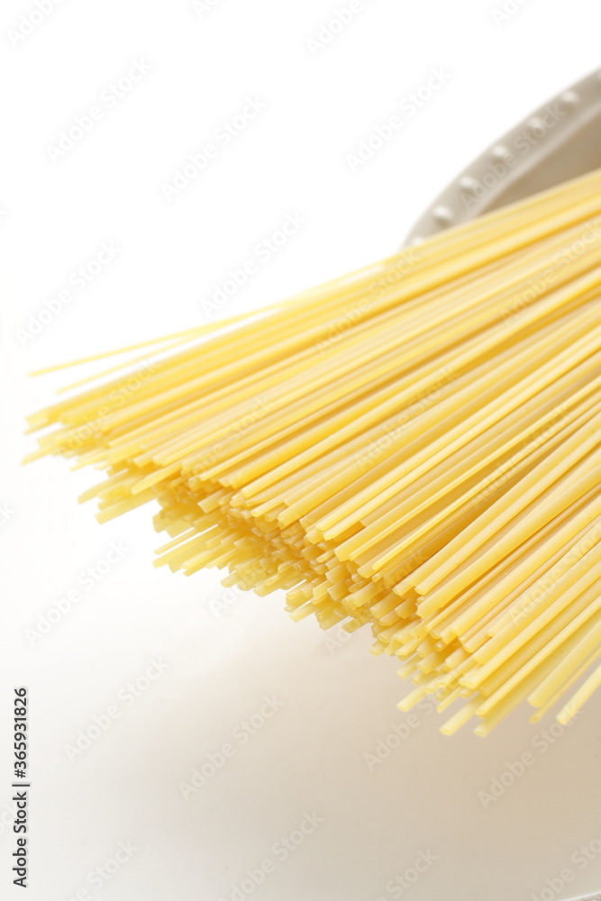 dried pasta noodles, linguine on white background dried pasta noodles, linguine on white background