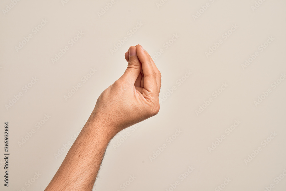 Hand of caucasian young man showing fingers over isolated white background doing Italian gesture with fingers together, communication gesture movement - obrazy, fototapety, plakaty 