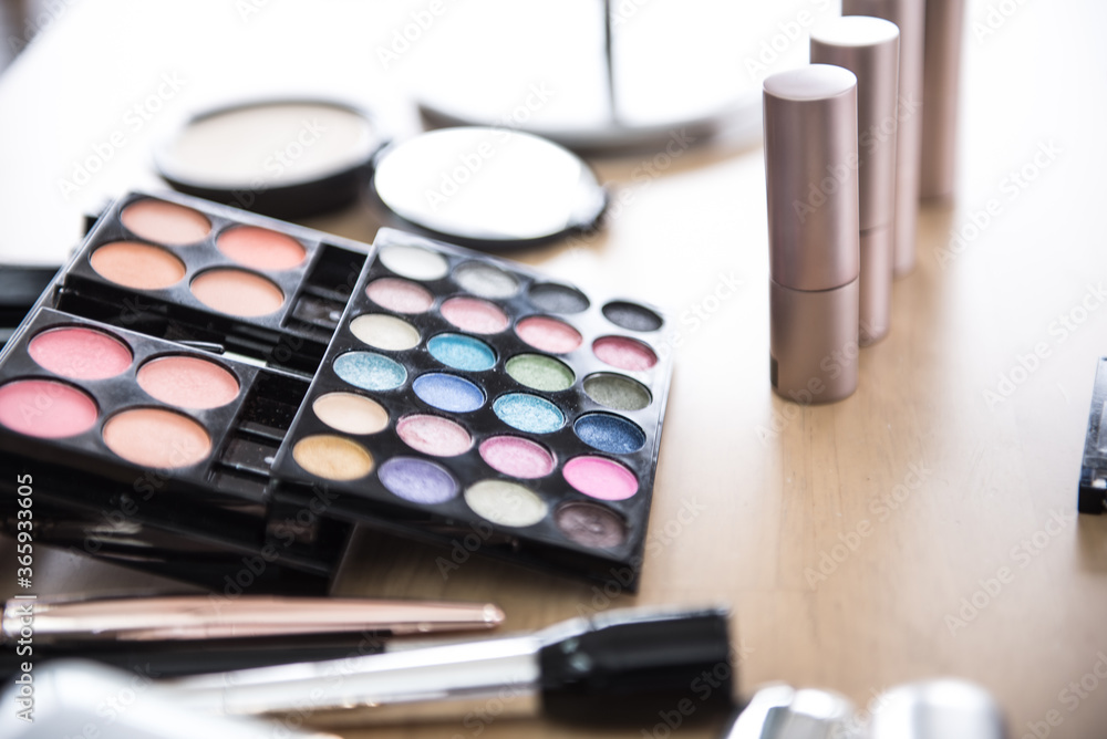 Cosmetics on a desk wood background, close up Cosmetics on a desk wood background, close up