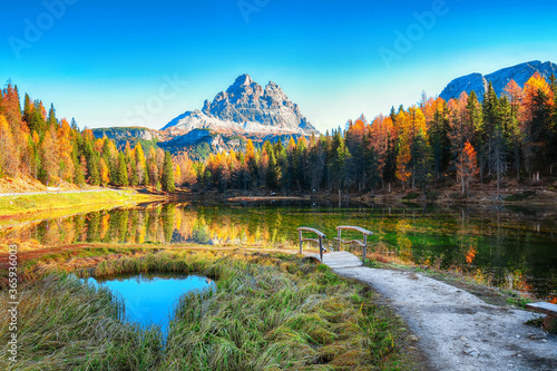 Astonishing view of popular travel destination mountain lake Antorno in autumn photo