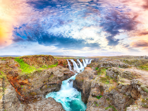 Dramaic view of  Kolufossar waterfall at sunset. photo