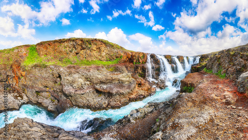 Majestic Kolufossar waterfall at summer sunny day. photo