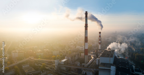 Air pollution in the city. Aerial view of the smog over the city in the morning  smoking chimneys of the CHP plant and the city s buildings - Wroclaw  Poland