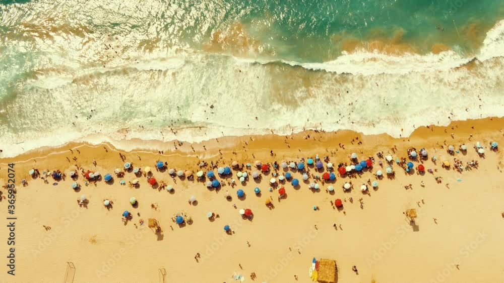 Aerial view of the beach and people swimming in the Mediterranean Sea, Drone Shot 4K.
Aerial view of the beach and people swimming in the Mediterranean Sea, Drone Shot 4K.