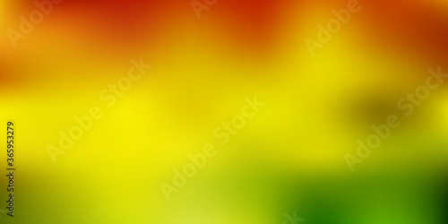 Light green, yellow vector gradient blur texture.