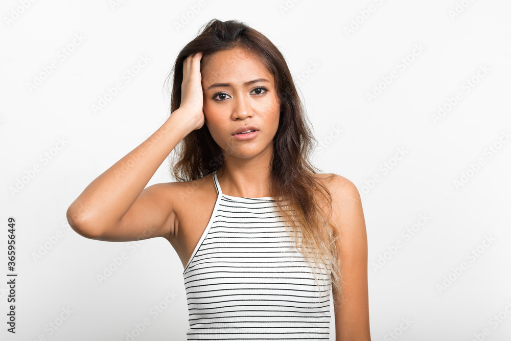 Portrait of young beautiful Asian woman with brown hair Portrait of young beautiful Asian woman with brown hair
