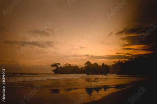 The beauty of the sunset with the beautiful color of the sky on the Pelang beach, Tulungagung, East Java, Indonesia photo