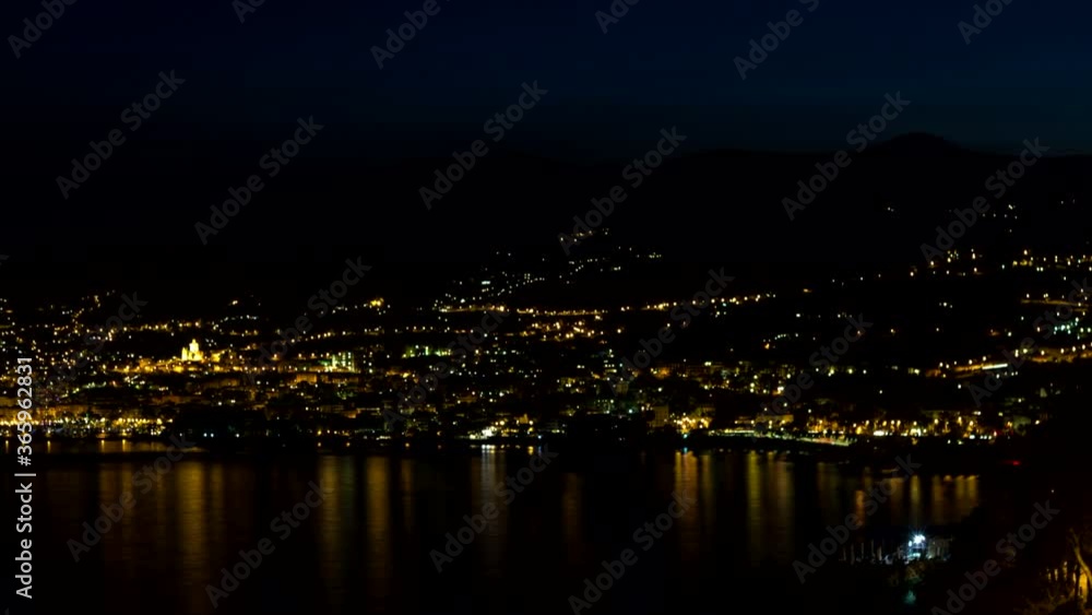 Sanremo aerial timelapse. From sunset to night over San Remo, district of Imperia, Liguria. Italian Riviera. Sea and coastline. Sanremo aerial timelapse. From sunset to night over San Remo, district of Imperia, Liguria. Italian Riviera. Sea and coastline.