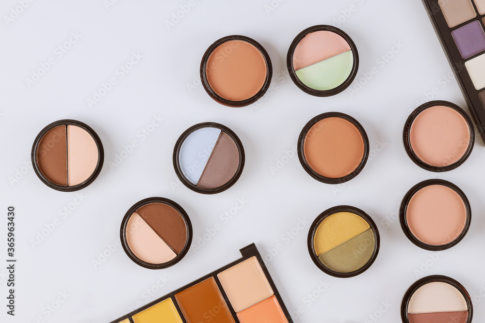 Set of eyeshadows in pastel beige colors pallet brown matte shadows, closeup of makeup product on an isolated white background - obrazy, fototapety, plakaty 