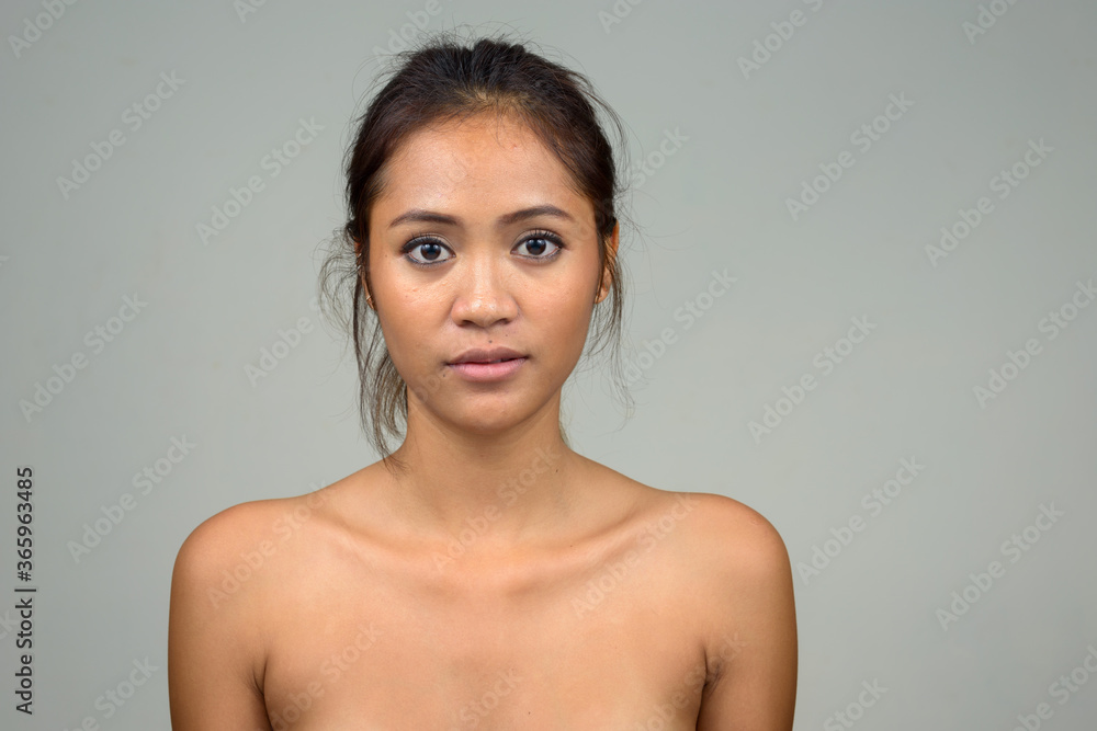 Obraz premium Young beautiful Asian woman shirtless as health and beauty concept