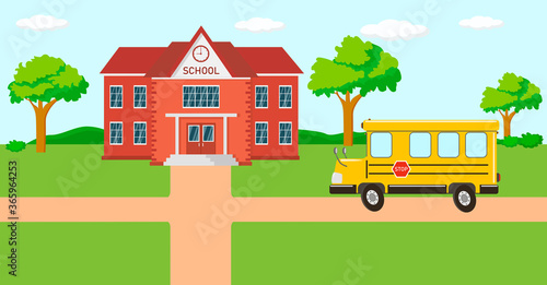 
Back to school concept. Yellow school bus is driving on the way to school. Beautiful landscape on the background