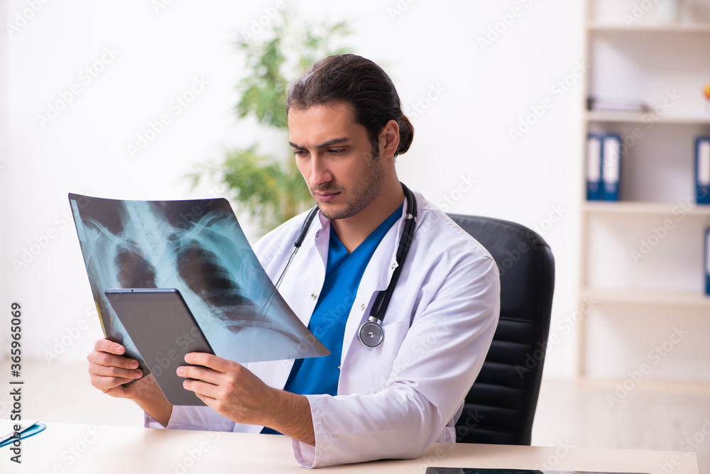 Young male doctor in telemedicine concept Young male doctor in telemedicine concept