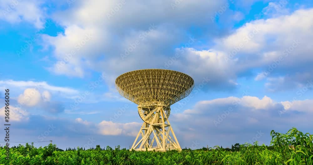 custom made wallpaper toronto digitalAstronomical radio telescope and fast moving sky clouds landscape.Time lapse photography.