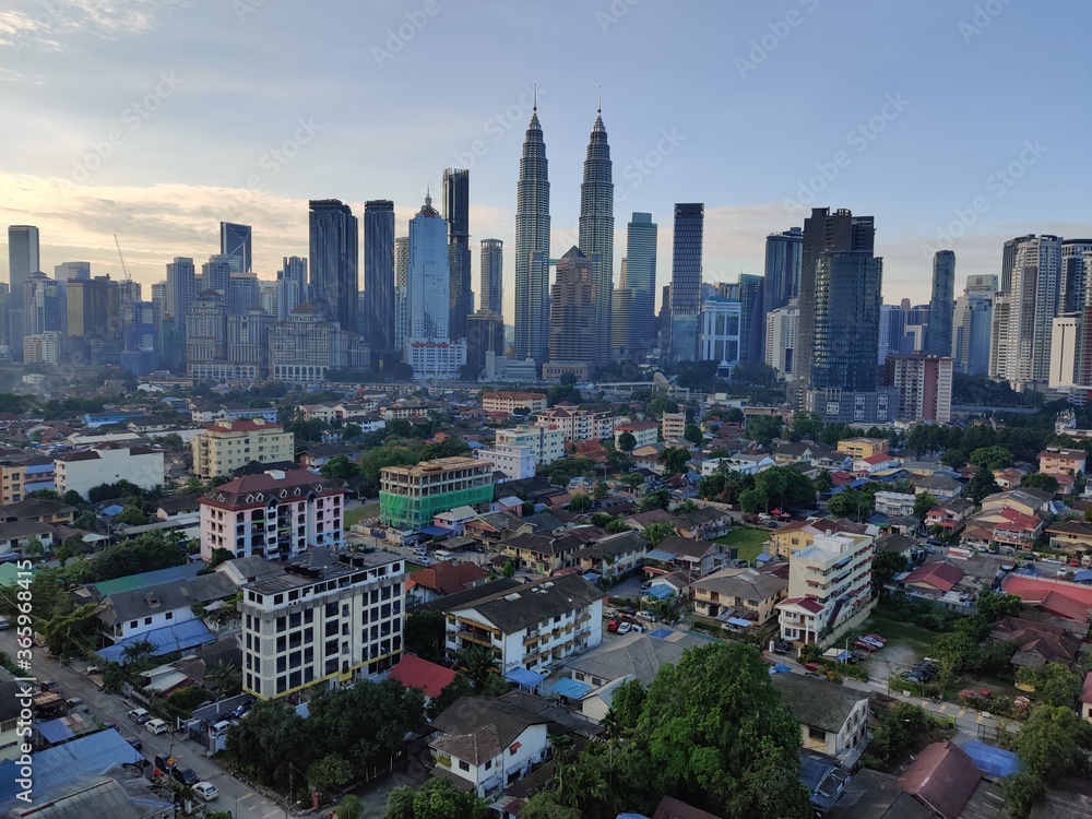 Fototapeta premium Kuala Lumpur, Malaysia - July 20, 2020: View of Kuala Lumpur skyline during sunrise.