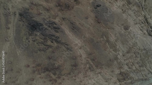 Mountain Karabash without plants due to terrible ecology. On the top of the mountain an Orthodox cross and the title “Bless and save”. Karabash city, Chelyabinsk region, Russia