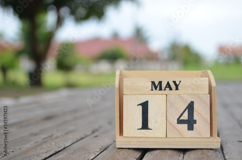 May 14, Number cube with a natural background.