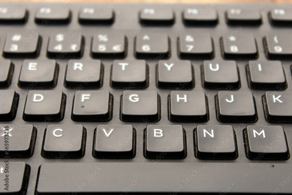 a black color computer keyboard a black color computer keyboard