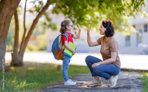 Parent and pupil go to school