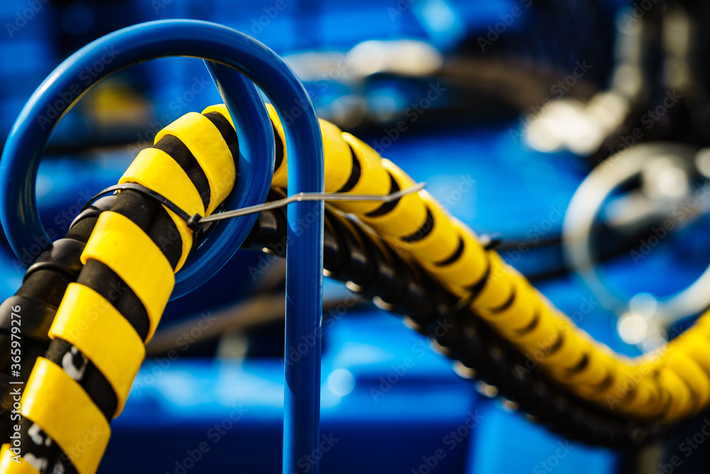 Hydraulic connections hoses in spiral wrap Stock Photo Adobe Stock