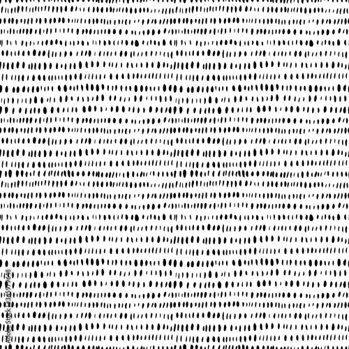 Grunge vertical small brushstrokes seamless vector pattern. Brush strokes dashes and shapes. Hand drawn abstract ink background. Lines of dashes, small splotches and blobs. Abstract wallpaper design