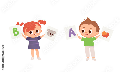 Two Kids, boy and girl holds leanning flashcards. Kids with english flashcards. Cards with letters. Learning English.