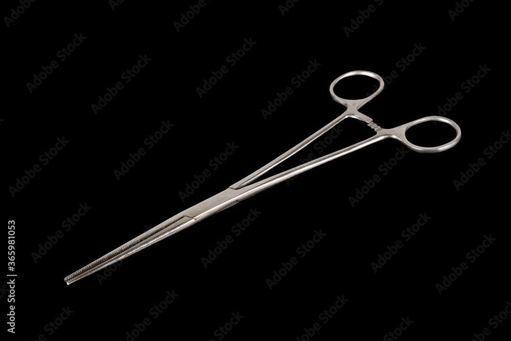 Forceps isolated on a black background Forceps isolated on a black background