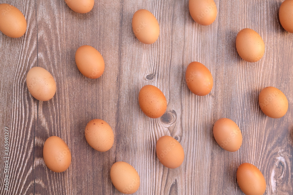 Eggs in basket on wood table background and space for text Eggs in basket on wood table background and space for text