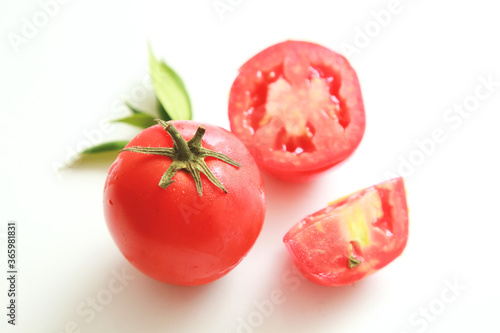 Ketchup or tomatoes sauce with ingredients on white background.
