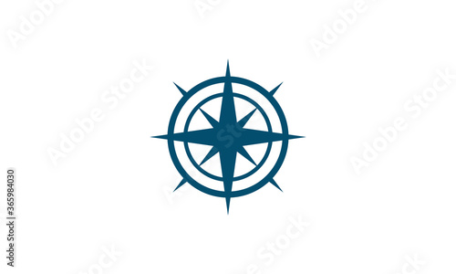 Flat abstract vector of a compass with a circle and star design and arrows point north, south west and east. Graphic is isolated on a white background. Great for branding, icons, symbols and logos.