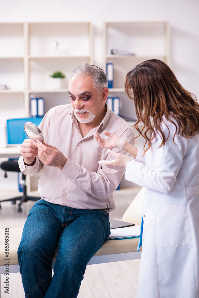 Old man visiting young female doctor for plastic surgery Old man visiting young female doctor for plastic surgery