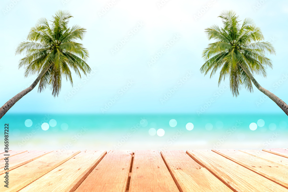 Selective focus of old wooden table with beautiful beach background for display your product.