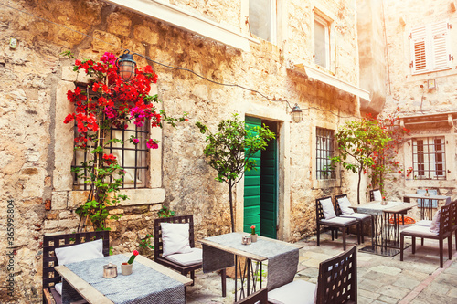 Cafe on the street in Old Town in Kotor, Montenegro. Famous travel destination