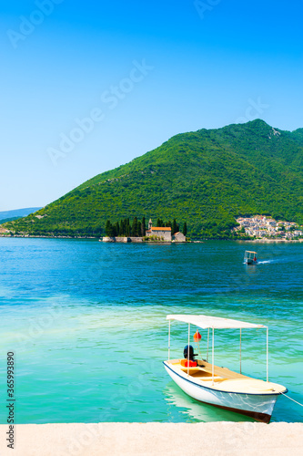 Beautiful shore in Perast town and view of St. George island in Kotor bay, Montenegro. Famous travel destination.