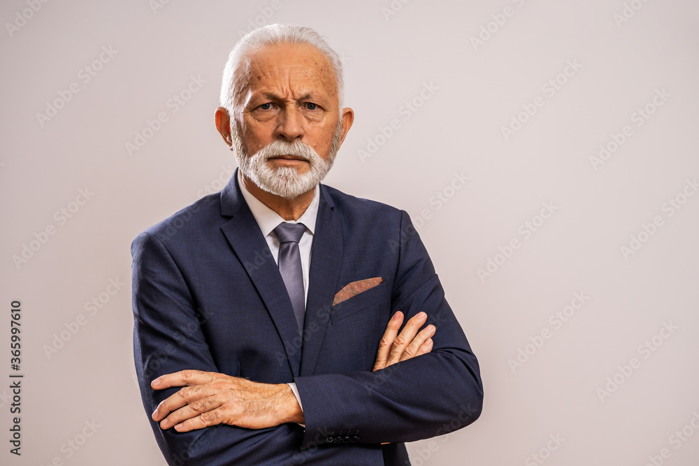 Portrait of serious and authoritative senior businessman. Portrait of serious and authoritative senior businessman.