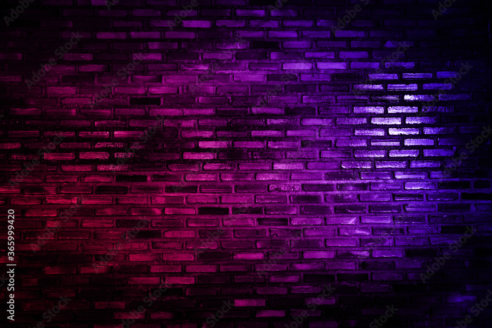 Neon light on brick walls that are not plastered background and texture. Lighting effect red and blue neon background vertical of empty brick basement wall. Neon light on brick walls that are not plastered background and texture. Lighting effect red and blue neon background vertical of empty brick basement wall.