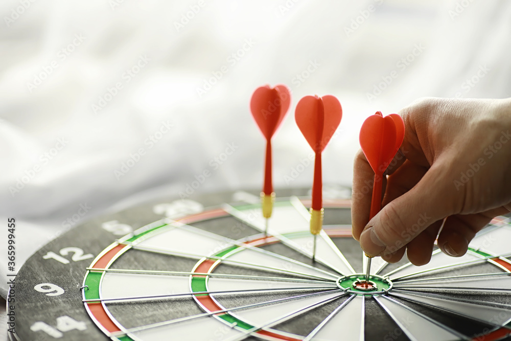 Fototapeta premium Darts. The dart for playing in the game board is stuck. Hit the sector in darts. The concept of a successful strategy.