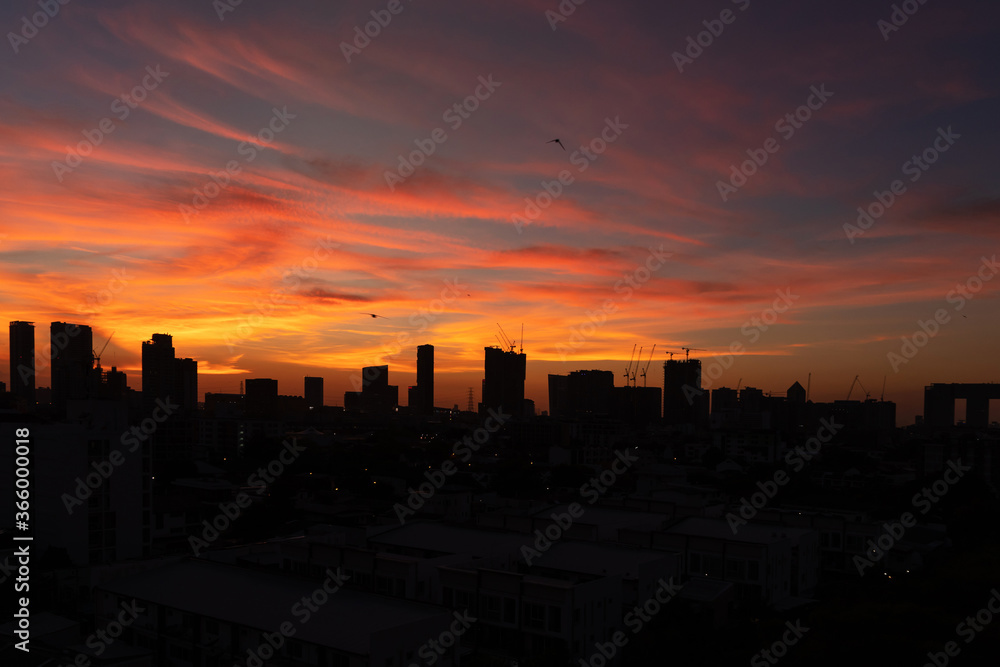Silhouette of skyscraper city landscape background with beautiful sunset sky.
