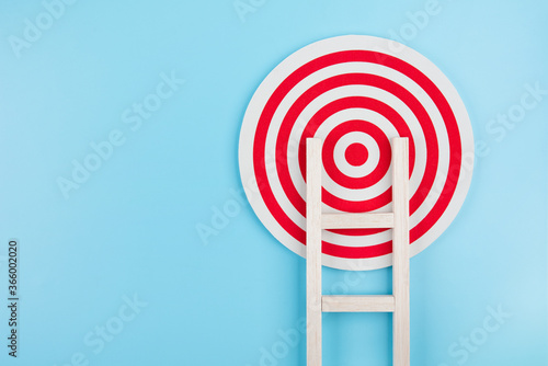 Staircase target on blue background growth development planning business concept