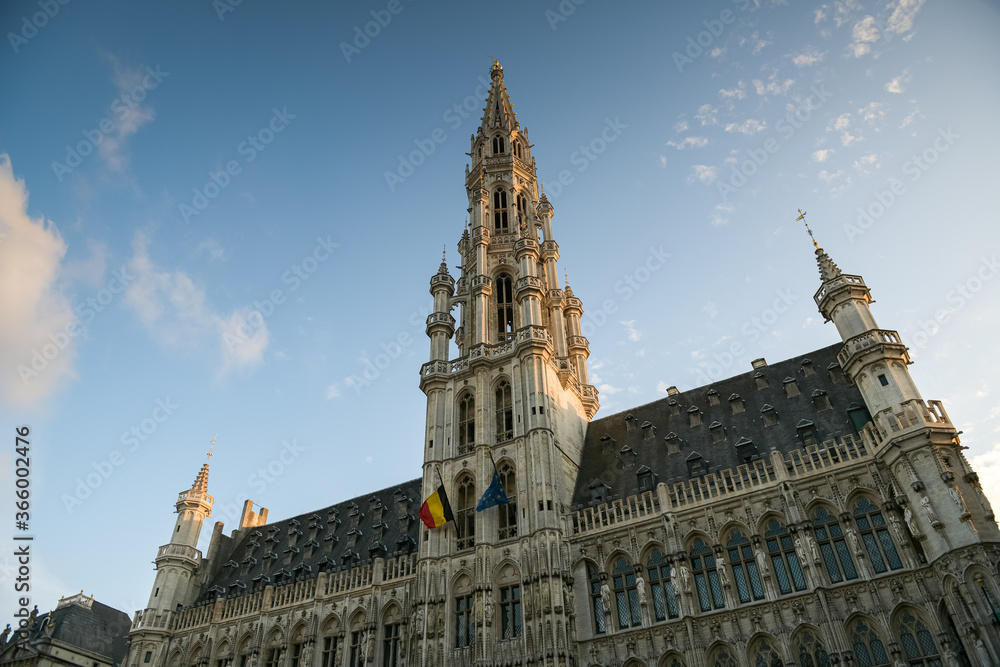 Fototapeta premium Sunset in Grand Place Market of Brussels in Belgium with blue sky and warm light