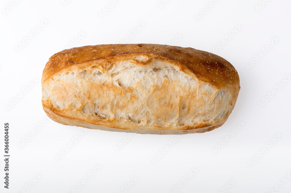 Small french baguette isolated on light background. Small french baguette isolated on light background.