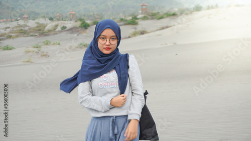 Asian hijab girl is in the desert, Gumuk Pasir, Yogyakarta photo