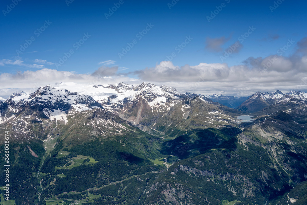 Bernina range and lake from above Poschiavo valley, Alps, Switzerland Bernina range and lake from above Poschiavo valley, Alps, Switzerland