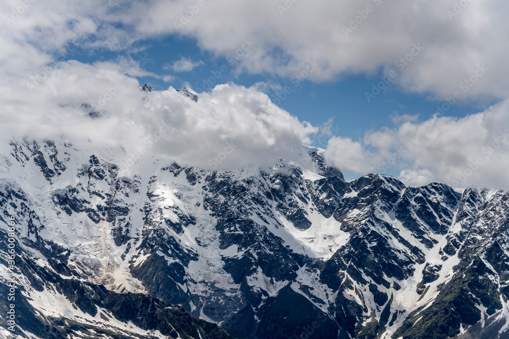 Antigine peak rocky steep slopes in Mount Rosa range  in  late spring, Alps, Italy