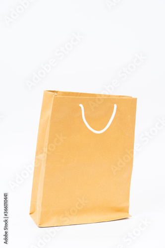 Shopping bag made from recycle paper on white background
