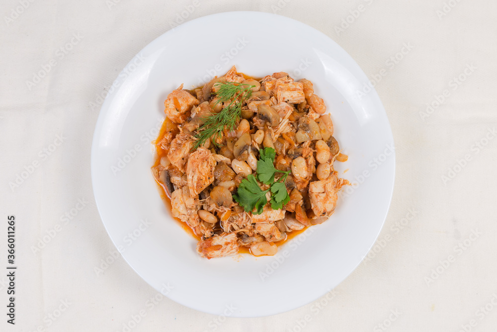 Stew beans with mushrooms, chicken in tomato sauce, top view Stew beans with mushrooms, chicken in tomato sauce, top view