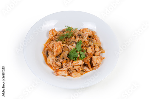 Beans with mushrooms and chicken, stewed in tomato sauce
