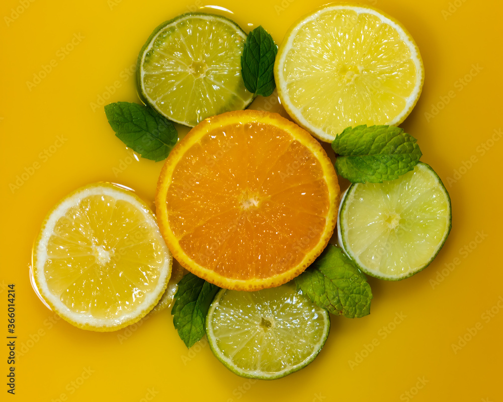Lemons and limes around orange Lemons and limes around orange