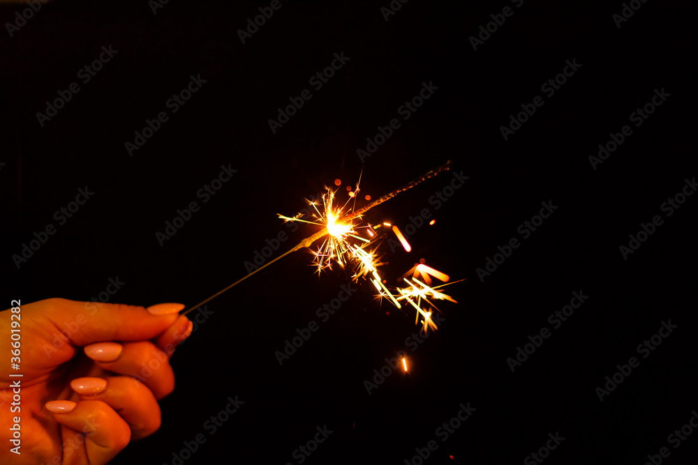 closeup view of burning sparkler closeup view of burning sparkler